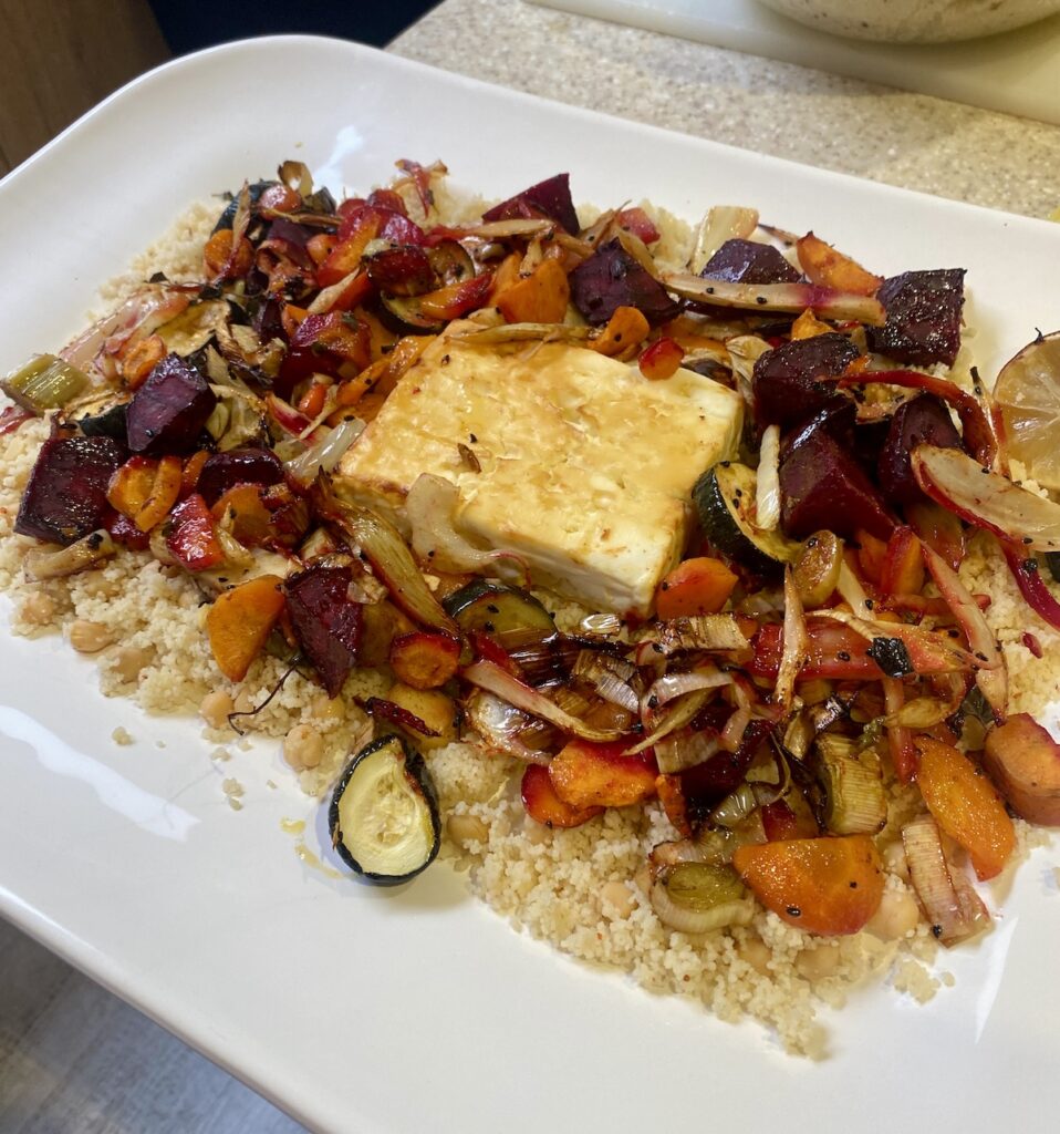 A platter of roasted veg and feta traybake.